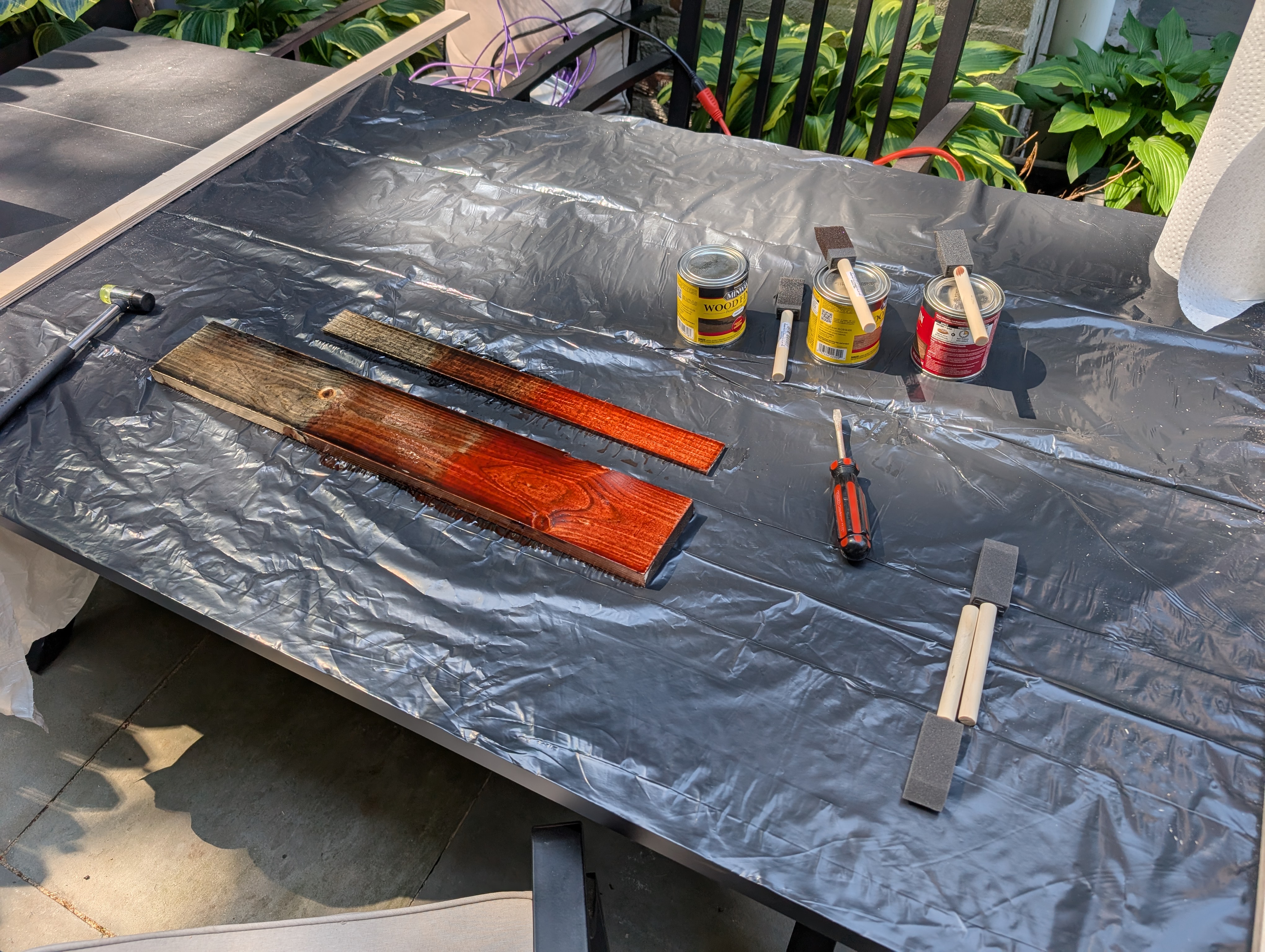 stained wood in black and red
