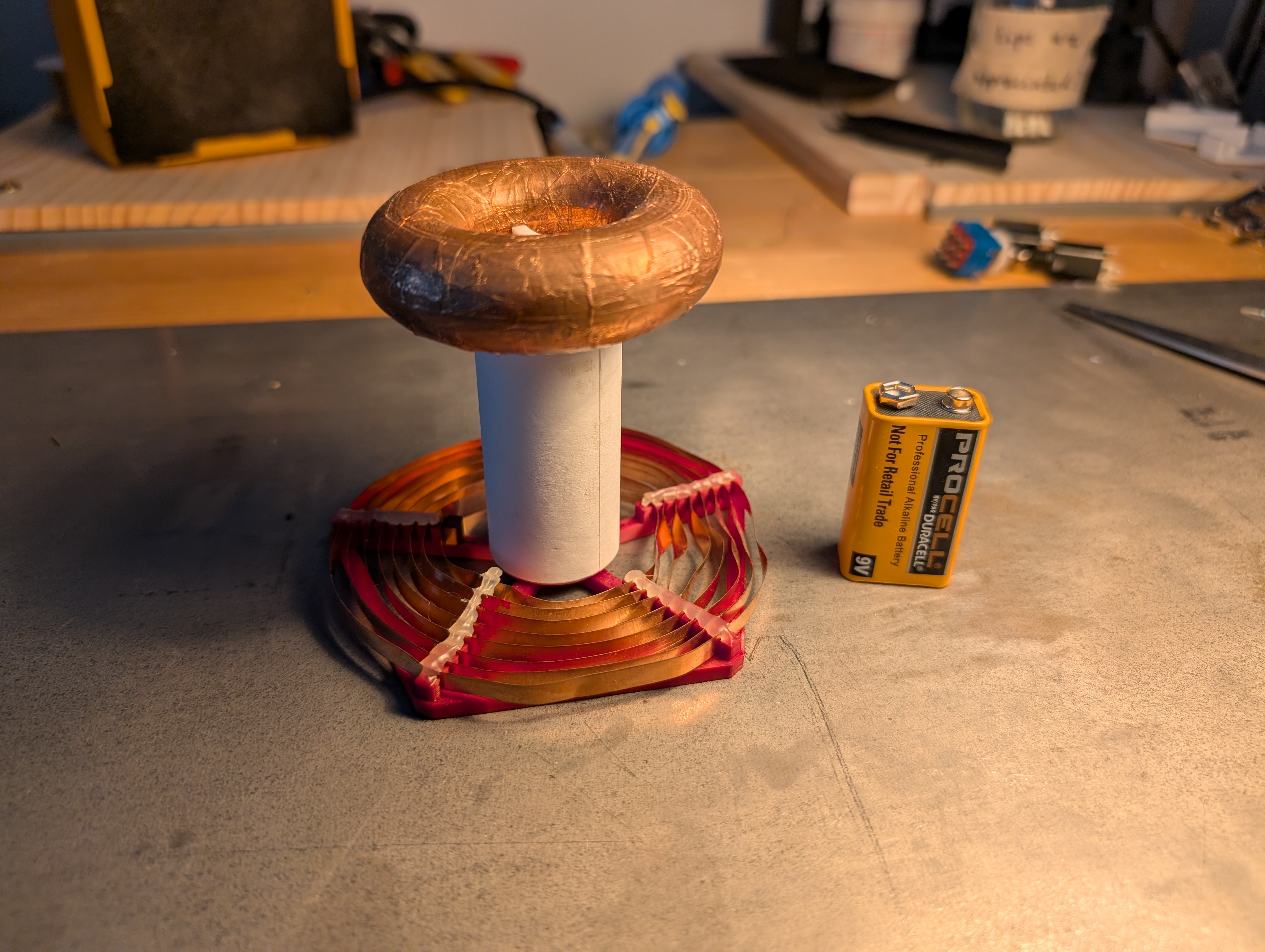 a small tesla coil about twice as tall as a 9 V battery