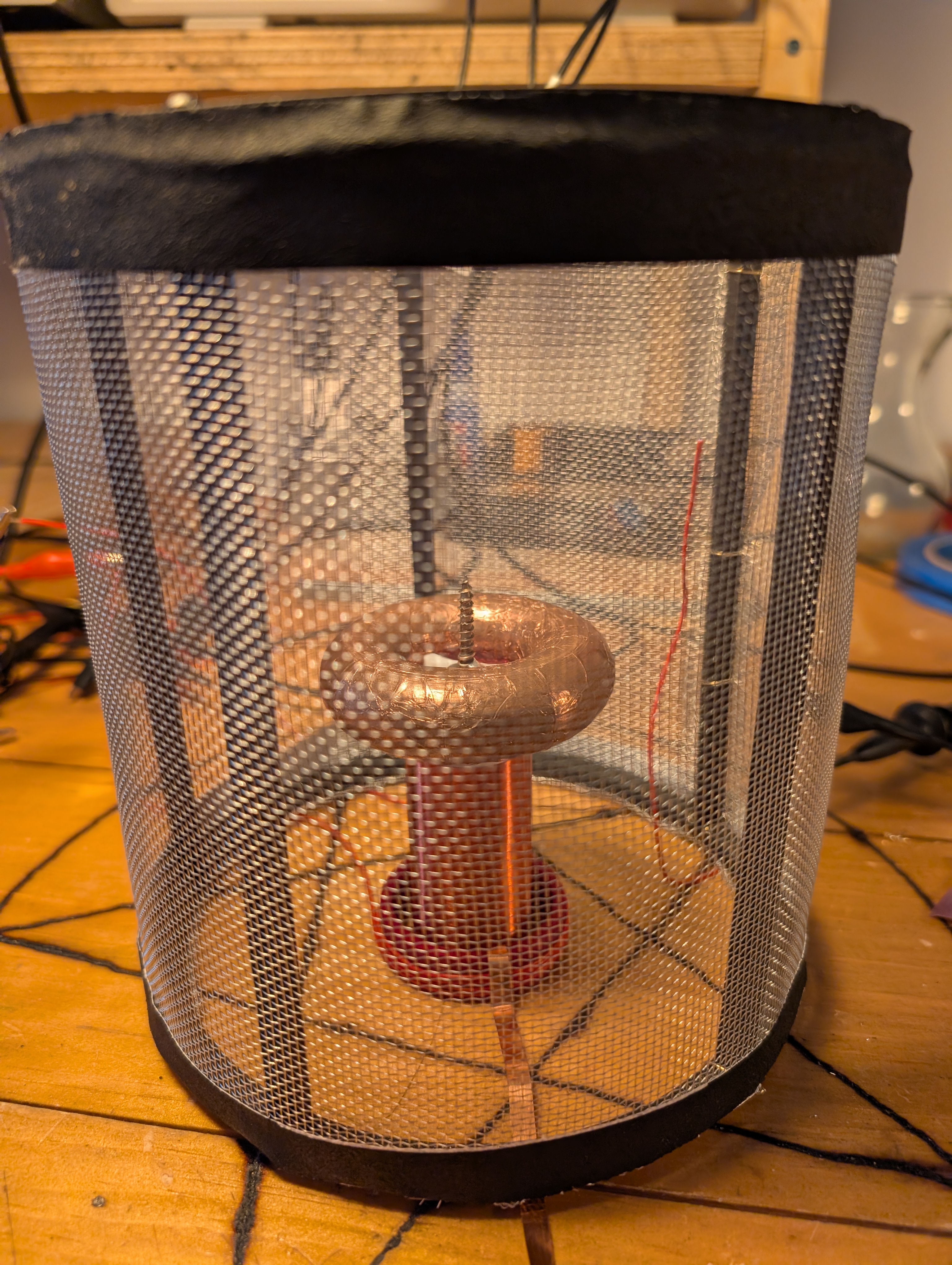 a tesla coil inside a mesh cage