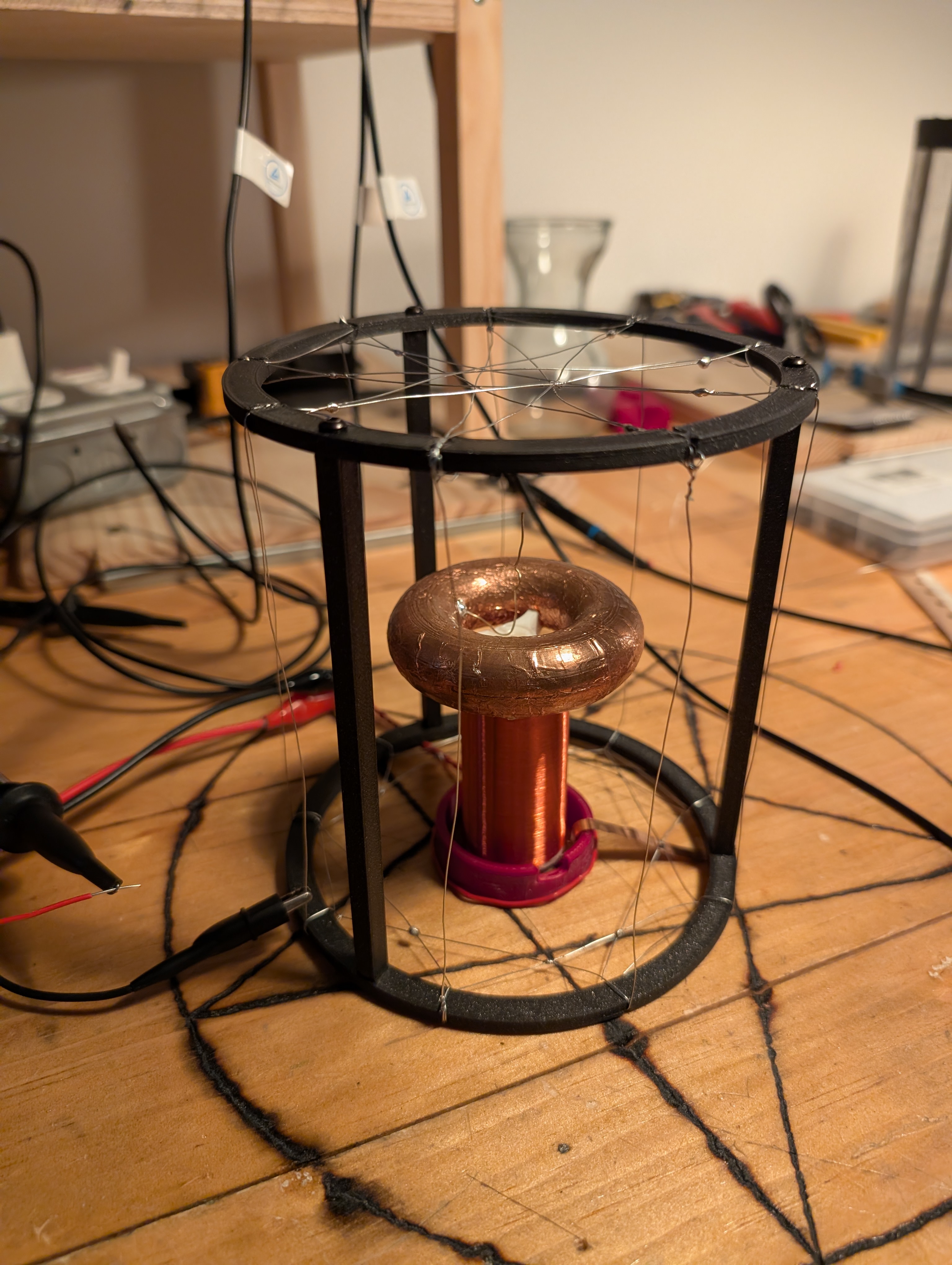 a tesla coil inside a thin wire cage.