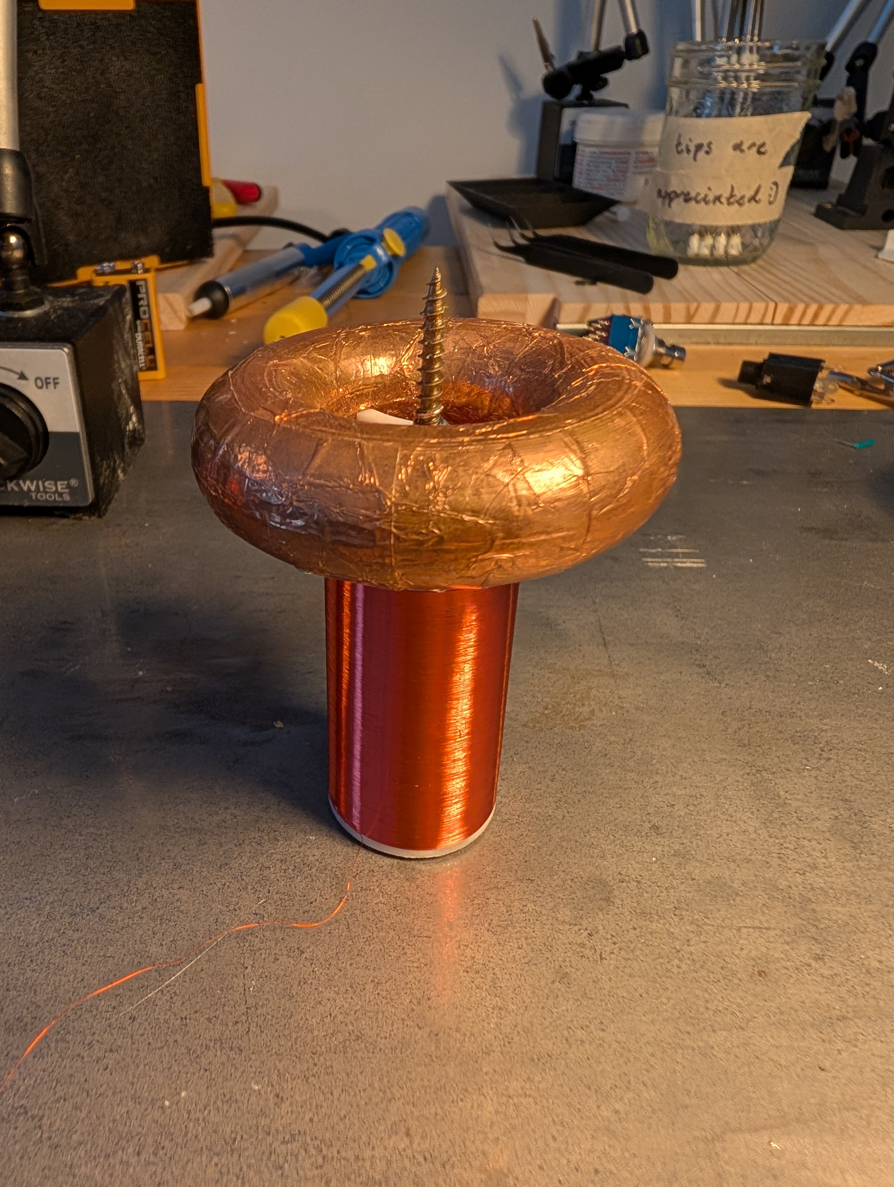 a tesla coil secondary with toroid and screw